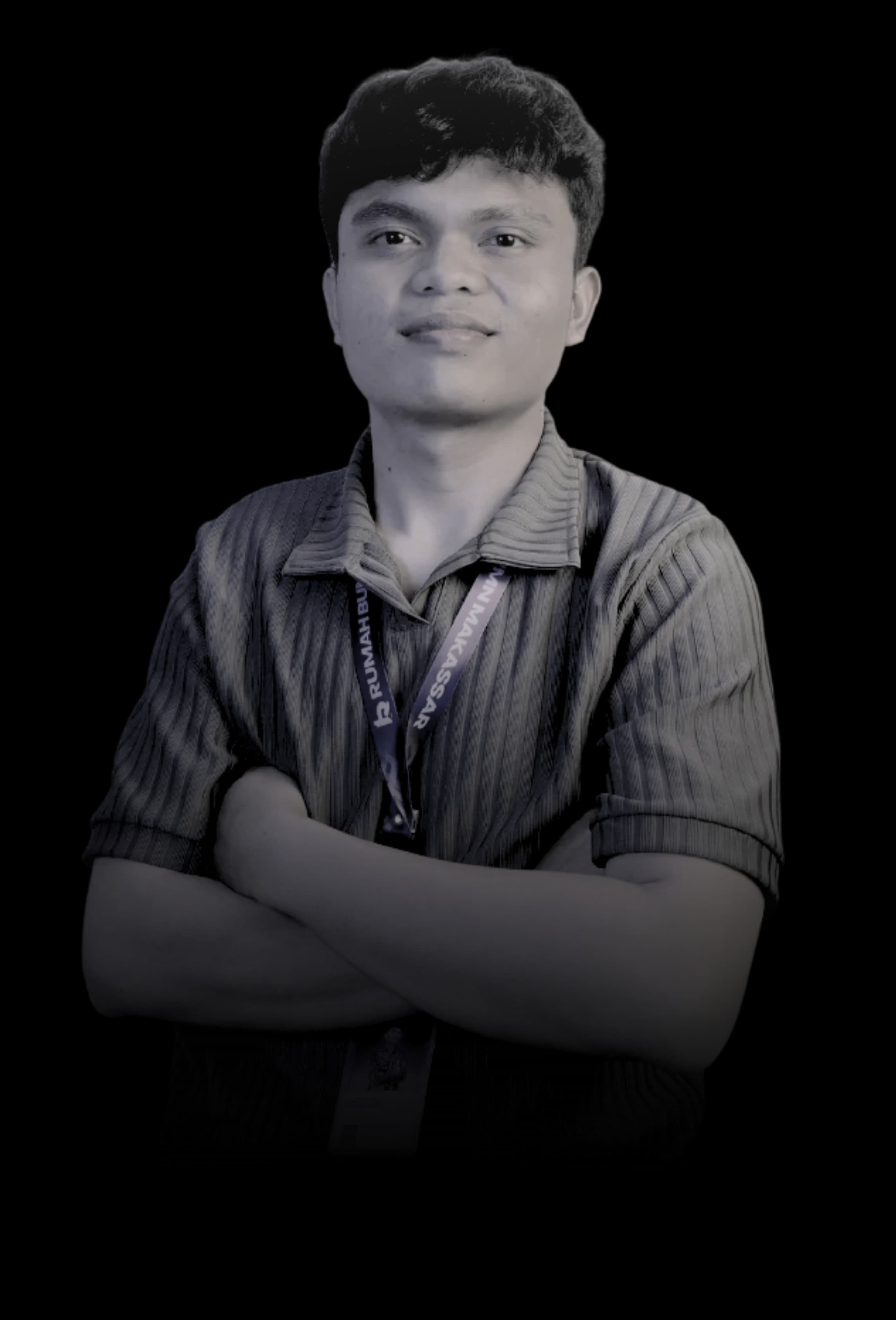 Riswan Ramadhan standing with folded arms